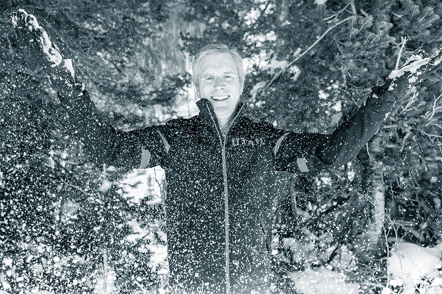 Jim Steenburgh, professor for the U's Department of Atmospheric Sciences, tosses a handful of the "greatest snow on earth." (Photo courtesy of the University of Utah)