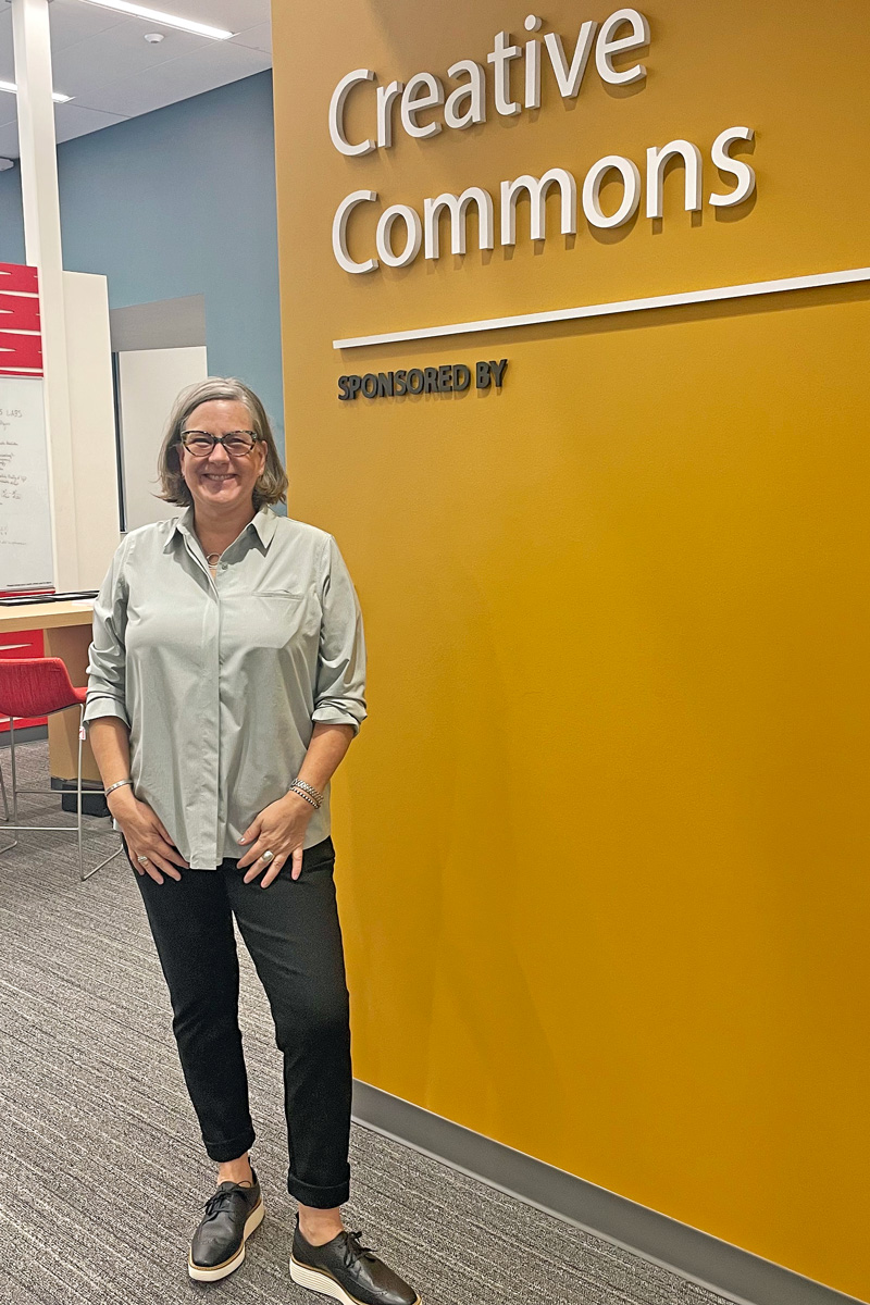 Holly K. Johnson, associate director for Digital Learning Innovation and Outreach, stands outside of Adobe Creative Commons at Kahlert Village. (Photo by Lori Hansen)