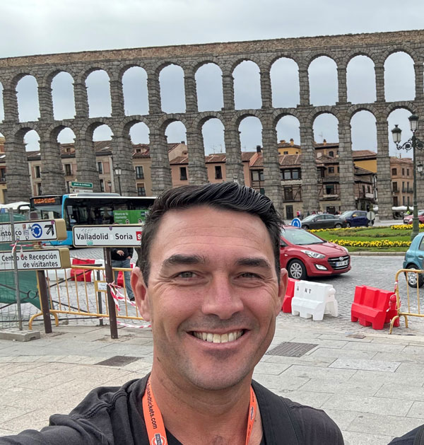 Puzey in front of the Roman aqueducts in Segovia, Spain, during a recent trip with his oldest son. (Courtesy of Brett Puzey)