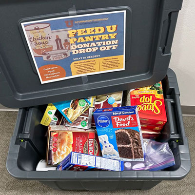 A 30 gallon tote filled to the brim with donations.