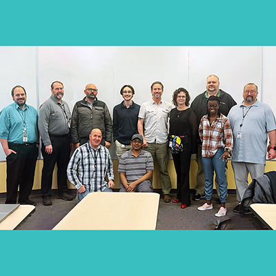 Standing, from left: Brad Avery, Lewis Hofmann, Rebwar Baesmat, Dylan Russel, Gabe Mickel, Kelly Tappenden, Kelly Marosok, Amen Koutowogbe, Jason Genovesi, and Clay Postma; kneeling, from left: Cody Rasmussen and Muazzamfaraaz Mohammed.