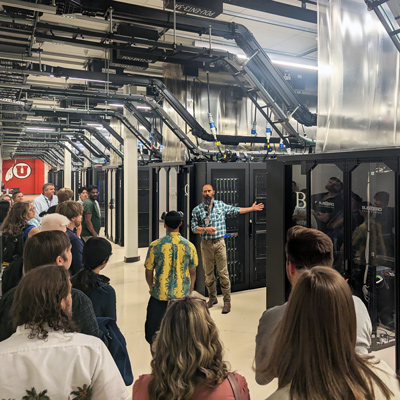 Data Center Manager Chris Pedersen, center, leads a tour of the Downtown Data Center on June 18, 2025.