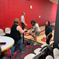 Angelica Chacon accidentally throws her bowling ball behind her as UIT employees bowl September 1, 2022, at the A. Ray Olpin Union bowling alley.