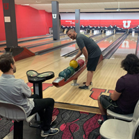 UIT employees bowl September 1, 2022, at the A. Ray Olpin Union bowling alley.