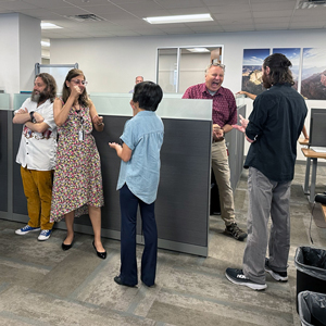 DCIO staff play Rock, Paper, Scissors.