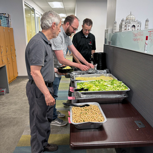 Ray Daurelle (from left), Dan Gillen, and Roger Kowallis get their lunches.