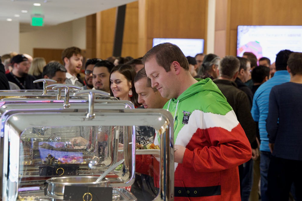 Dax Christensen (green, white, and red hoodie) at the buffet line