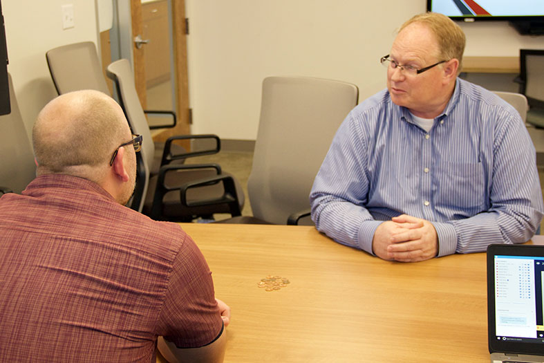 Craig Bennion, left, illustrates 